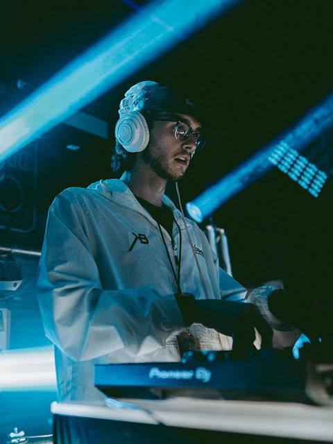 Professional event photography of young DJ