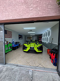 Garage with a yellow Slingshot ready for detailing