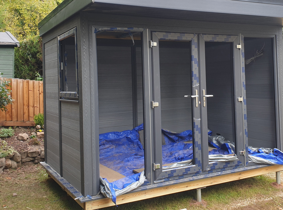 Ground screws supporting garden room.jpg