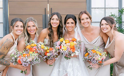Bride with bridesmaids for a candid photo.
