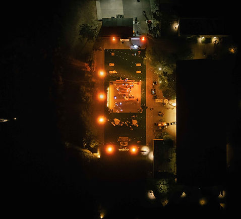 Aerial drone shot of the wedding venue reception at night.