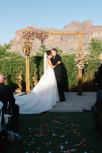 Bride & groom first kiss at ceremony.