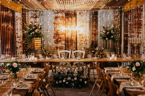 Romantic wedding reception flowers at The Stables of Somersby designed by Kurtzy’s wedding florist