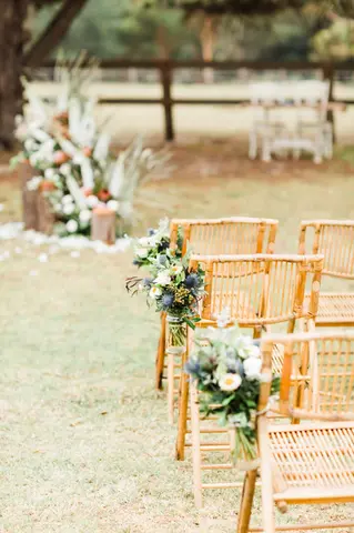 Romantic wedding ceremony flowers at The Stables of Somersby designed by Kurtzy’s wedding florist