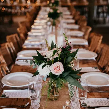 Romantic wedding reception flowers at The Stables of Somersby designed by Kurtzy’s wedding florist