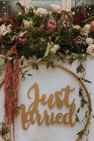 Romantic wedding reception flowers at The Stables of Somersby designed by Kurtzy’s wedding florist