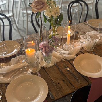 Elegant reception tables with florals, candles, and styling at Somersby Gardens Estate by Kurtzy’s