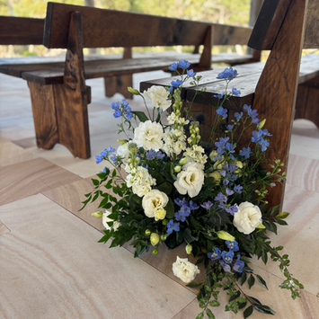 Romantic wedding ceremony flowers at Somersby Gardens Estate designed by Kurtzy’s wedding florist