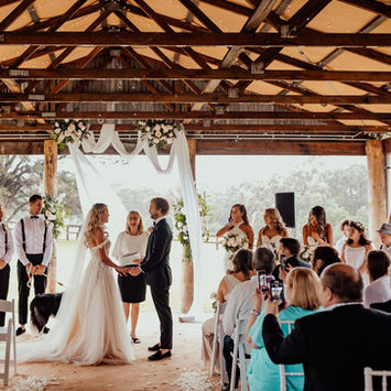 Romantic wedding ceremony flowers at The Stables of Somersby designed by Kurtzy’s wedding florist