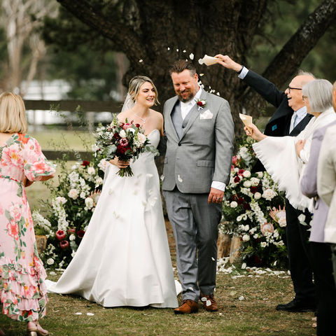 Romantic wedding ceremony flowers at The Stables of Somersby designed by Kurtzy’s wedding florist