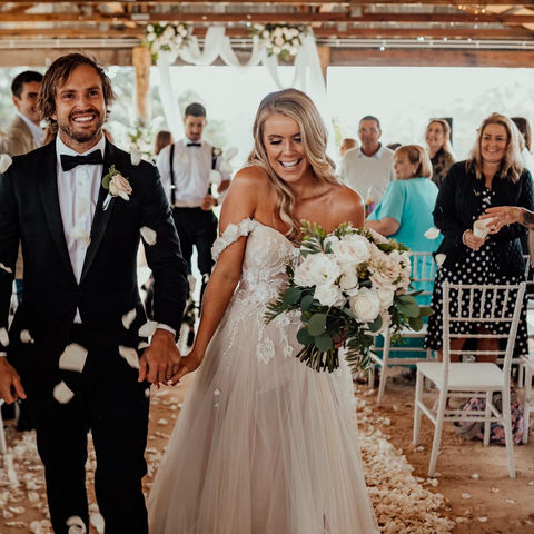 Romantic wedding ceremony flowers at The Stables of Somersby designed by Kurtzy’s wedding florist