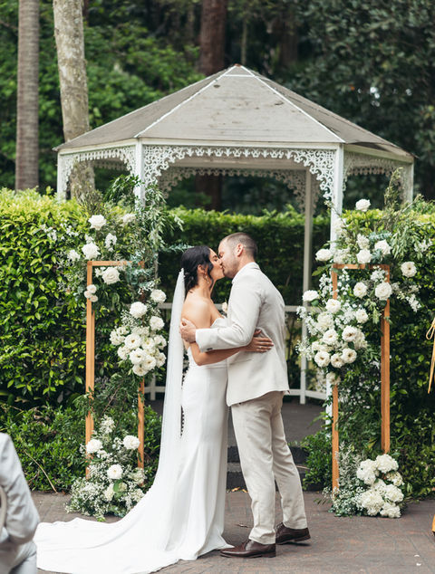 Romantic wedding ceremony flowers designed by Kurtzy’s wedding florist