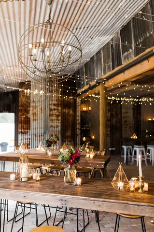 Romantic wedding reception flowers at The Stables of Somersby designed by Kurtzy’s wedding florist