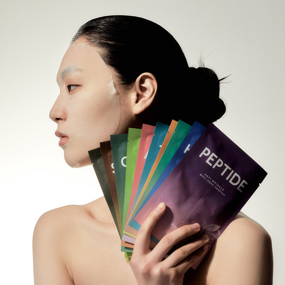 Model holding BARULAB The Clean Vegan Mask Korean vegan sheet masks