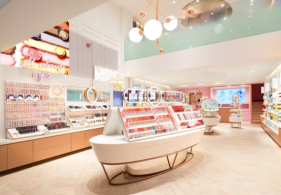 K-beauty retail store interior with multi-brand Korean skincare shelves