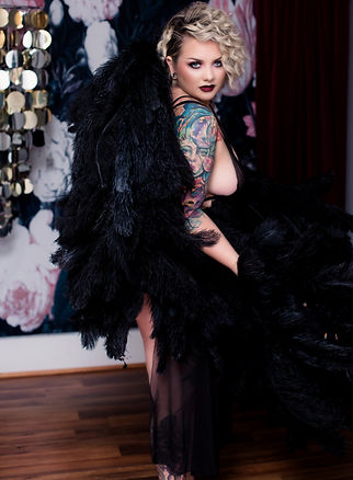 boudoir photo tattooed woman with black angel wings