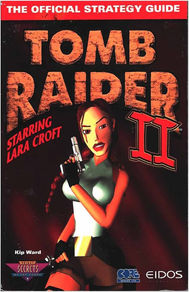 Cover of Tomb Raider II official strategy guide featuring Lara Croft holding a pistol, with bold title text and dark red background.