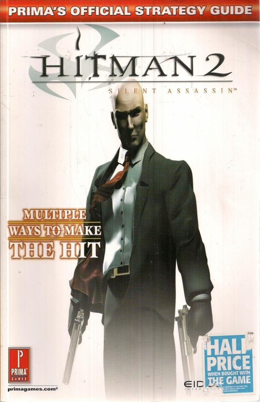 Cover of Prima’s Official Strategy Guide: Hitman 2 – Silent Assassin. Agent 47 stands in a black suit with dual pistols against a pale background. Text highlights “Multiple Ways to Make the Hit,” with Prima Games and Eidos logos at the bottom.