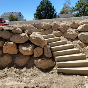 Two Tier Rock Retaining Wall with Stairs
