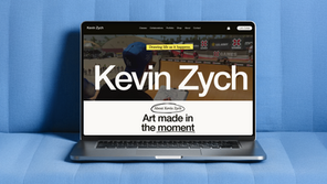 An open laptop with Kevin Zych's website on screen