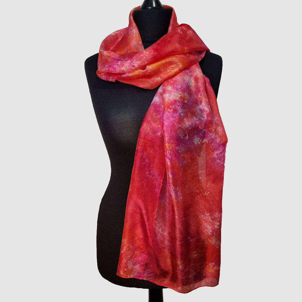 Thumbnail: 'Sunset' Hand Dyed Silk Scarf in red, orange and pink wrapped on mannequin