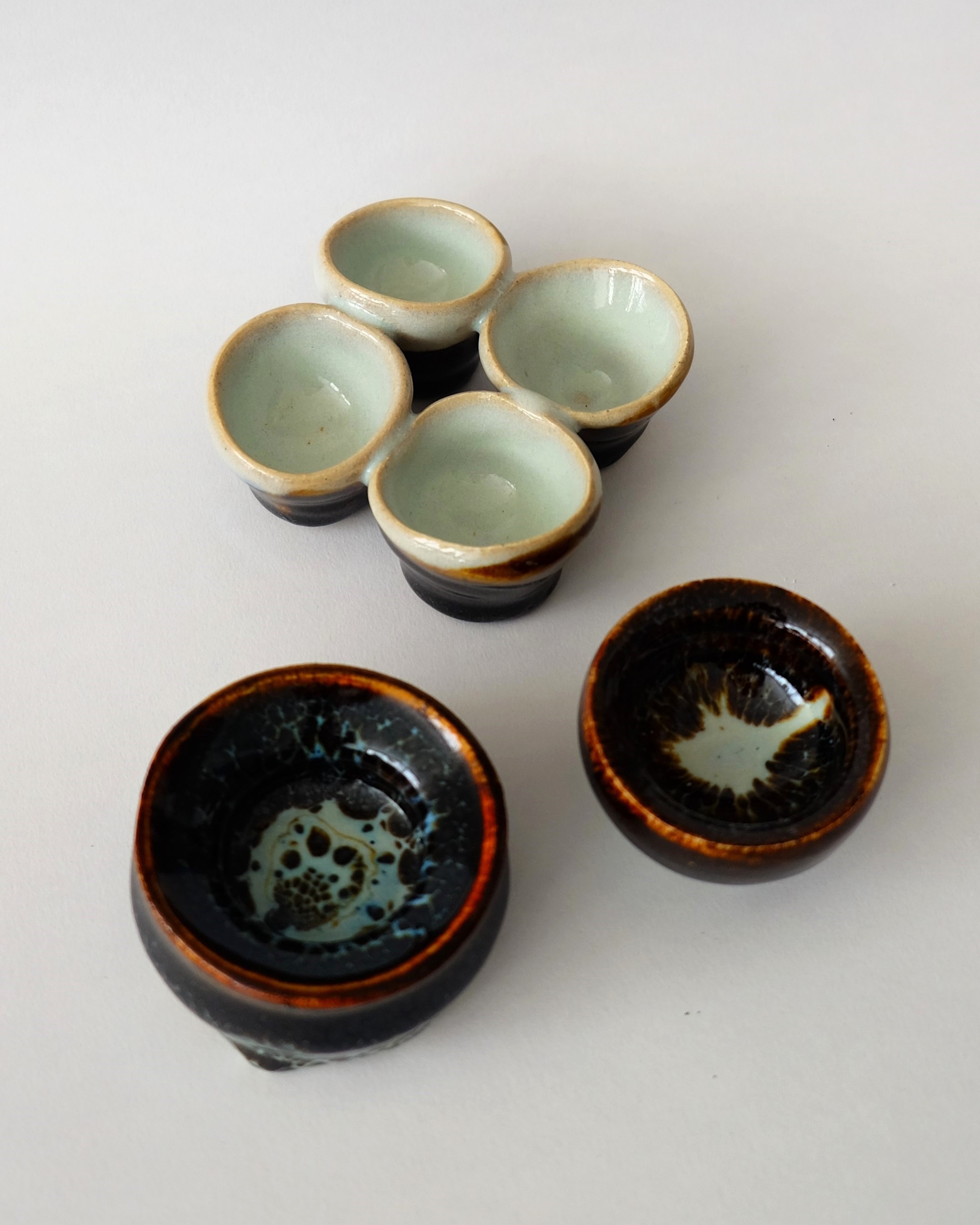 Blue and black ceramic sculptures and vases