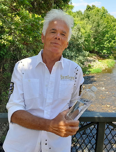 Doctor Schomer on a bridge over a river