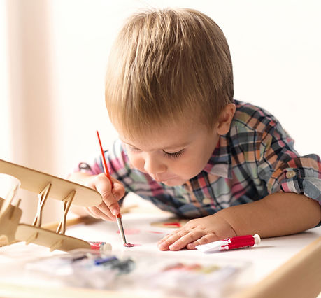 Child Painting Model Airplane