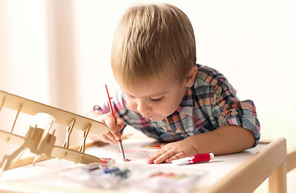 Child Painting Model Airplane