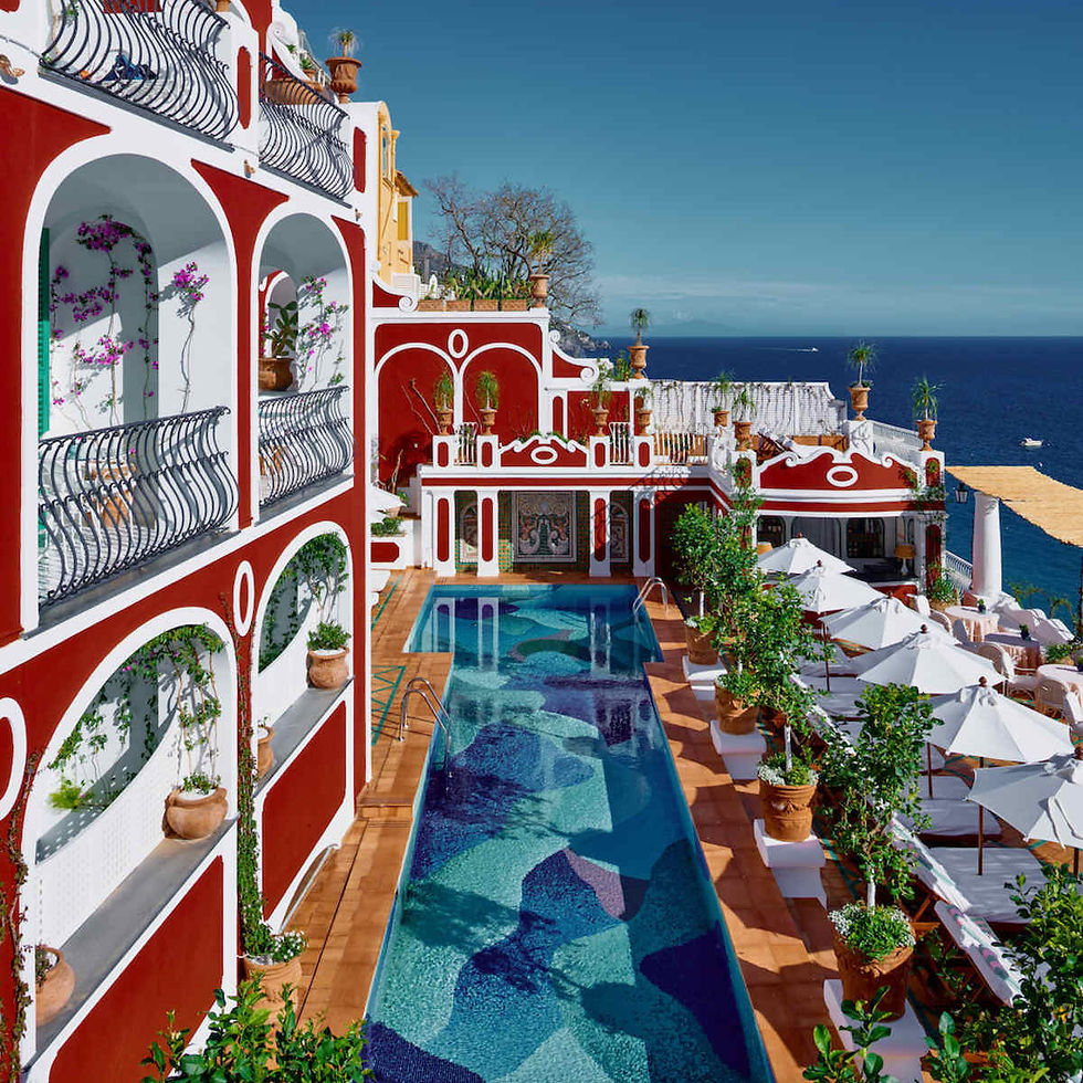 Hotel pool with umbrellas on the side