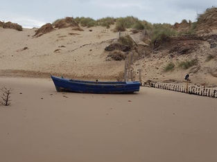 A boat washed up on the High Tide at Formby