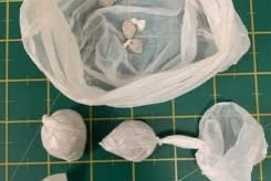 A man has been arrested after 50 wraps of crack cocaine and heroin and cash were seized in Bootle