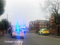 Police cordon off School Lane as we receive early reports of a stabbing in a Formby graveyard