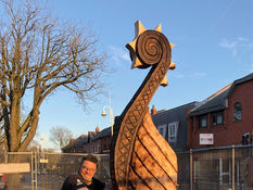 The Viking carving in the village has been moved so it can be preserved and a new tree planted