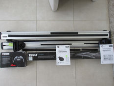 Two Thule roof bars and the attachments for the vehicle roof - £50 for both