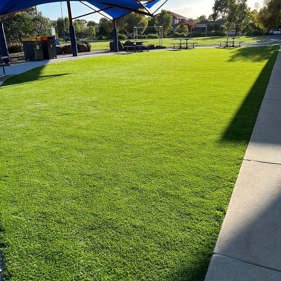 Wide angle view of a vibrant artificial grass sports field