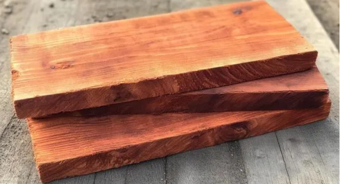 Close-up view of a cedar wood plank showing natural grain and texture