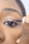 Draw a line with a liquid eyeliner from the inner corner of your eyelid towards the dot you marked on the center of your eyelid. Stay close to the lash line
