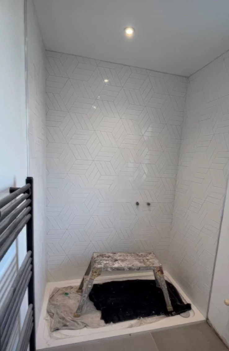 Showcasing our latest tiling endeavors that require the mastery of an experienced artisan. These tiles stand alone, underscoring the paramount importance of precision in their installation. Many tilers might find such tasks challenging. Tiling has evolved into an art form, departing from conventional norms. As evident in the images above, these tiles are distinctive and unique. The intricacies involved make this a potential minefield for errors, as illustrated in the accompanying image. We take pride, as does our satisfied client, in the impeccable appearance achieved through our meticulous craftsmanship.