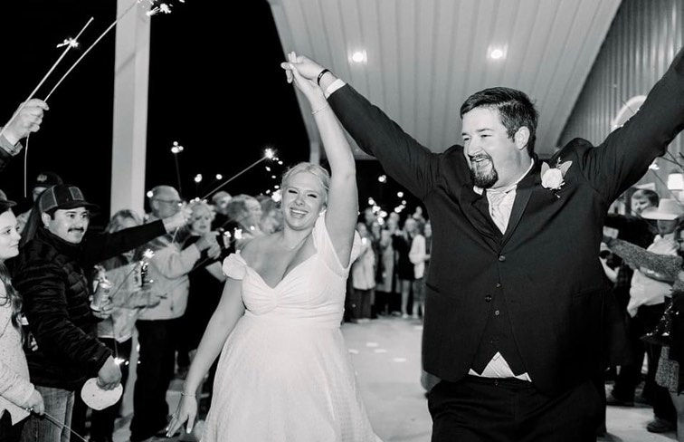 Happy bride and groom celebrating on their wedding day at Cornerstone Ranch Events Center wedding venue in Amarillo Texas Texas Panhandle