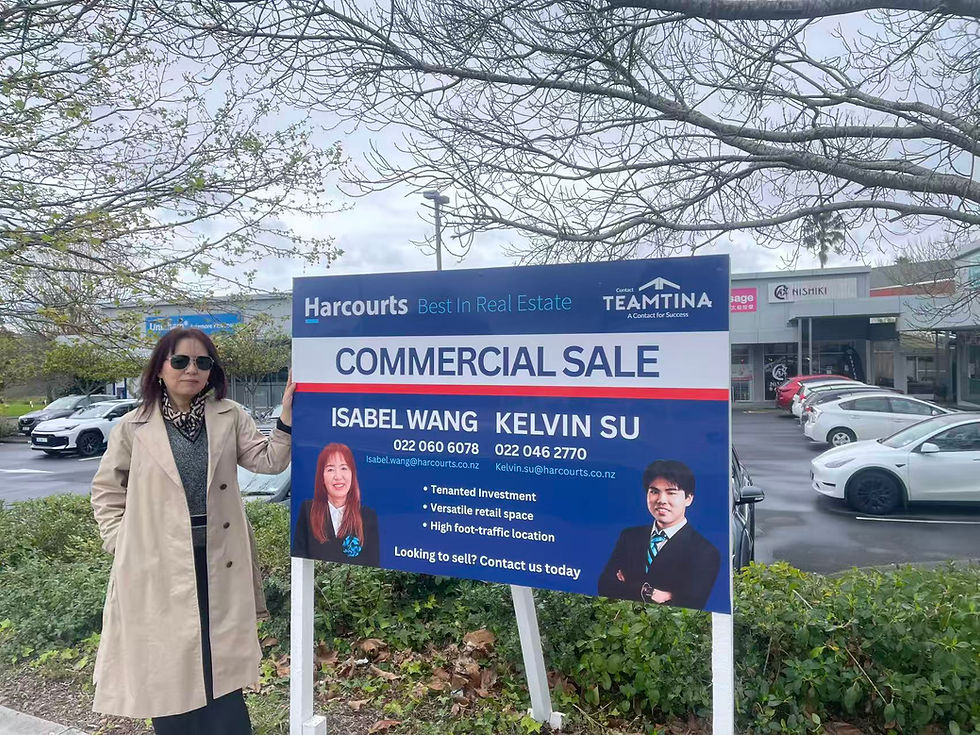 Isabel Wang and the Harcourts Howick commercial sale sign featuring Isabel Wang and Kelvin Su