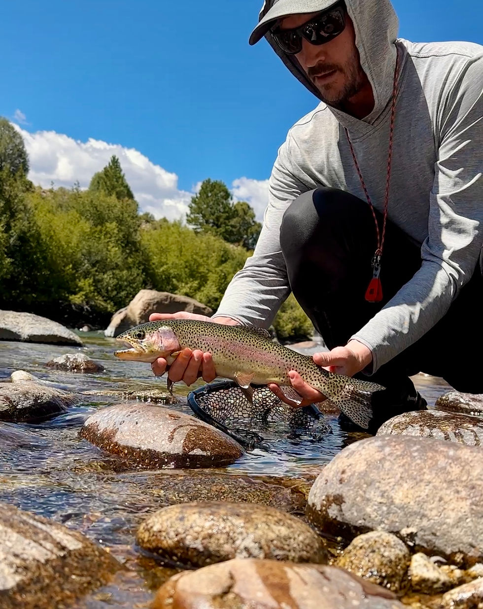 Shop manager, Michael, with a nice rainbow out of Brown Canyon this past week.