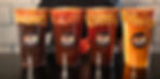 Vasos de michelada con borde de chile y logo de Drinkers.