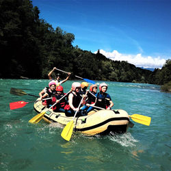 Paddling down the Sava river rafting Bled