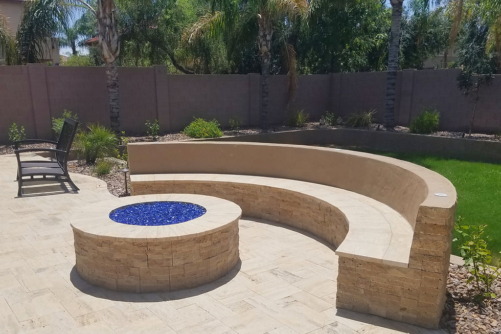 custom fire pit with built in bench seating and blue fire glass in gilbert