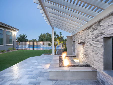 Backyard fire and water feature with overhead pergola