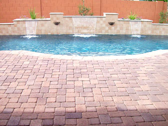 Custom pool waterfall and pool decking.