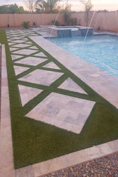 Artificial turf and pavers mixed walkway.