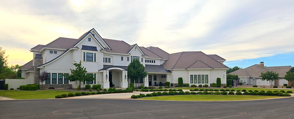 Modern Farmhouse property in the Circle G neighborhood of Gilbert which features a circular drive, lush grass, and intentional plantings
