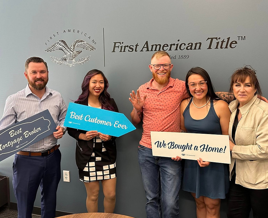 Community West Mortgage team celebrating a successful home closing with happy new homeowners.